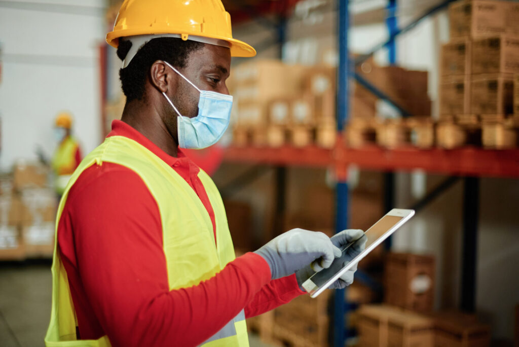 caucasian adult warehouse worker checks delivery o 2023 11 27 05 13 18 utc